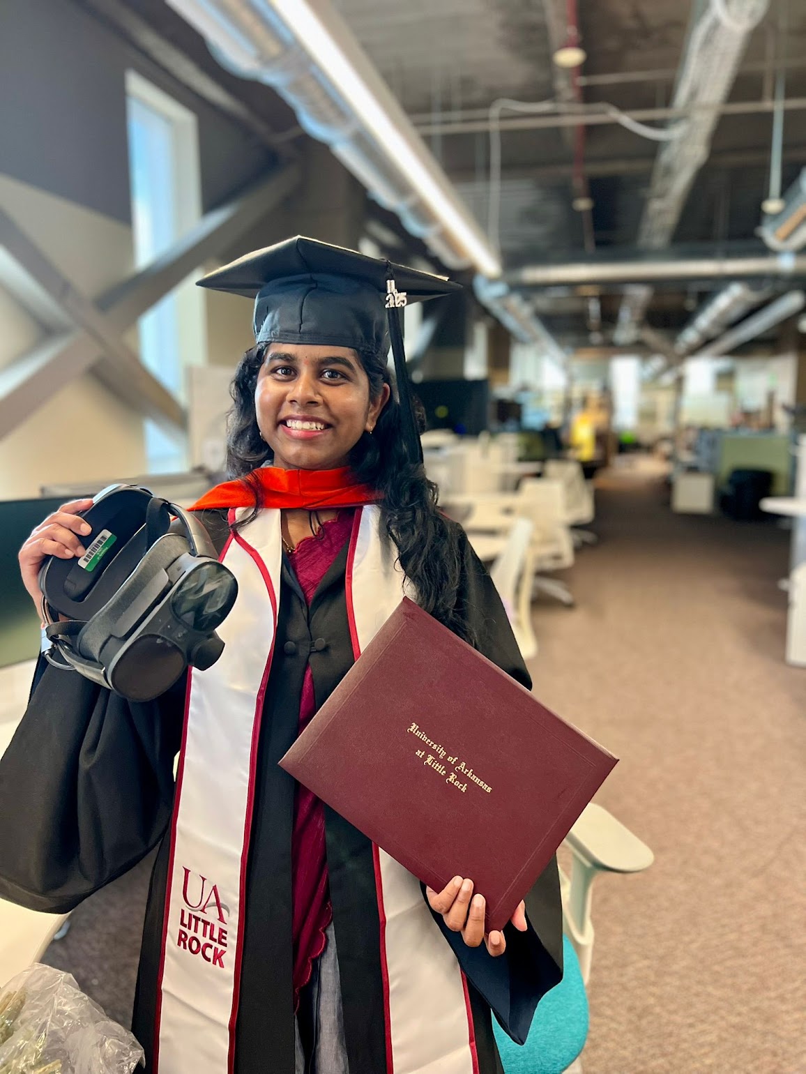 Jayasri wearing the decorated graduation cap at graduation