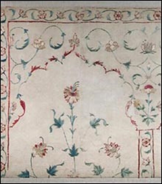 Indian embroidered cotton fragment showing a cusped arch and flowering plant